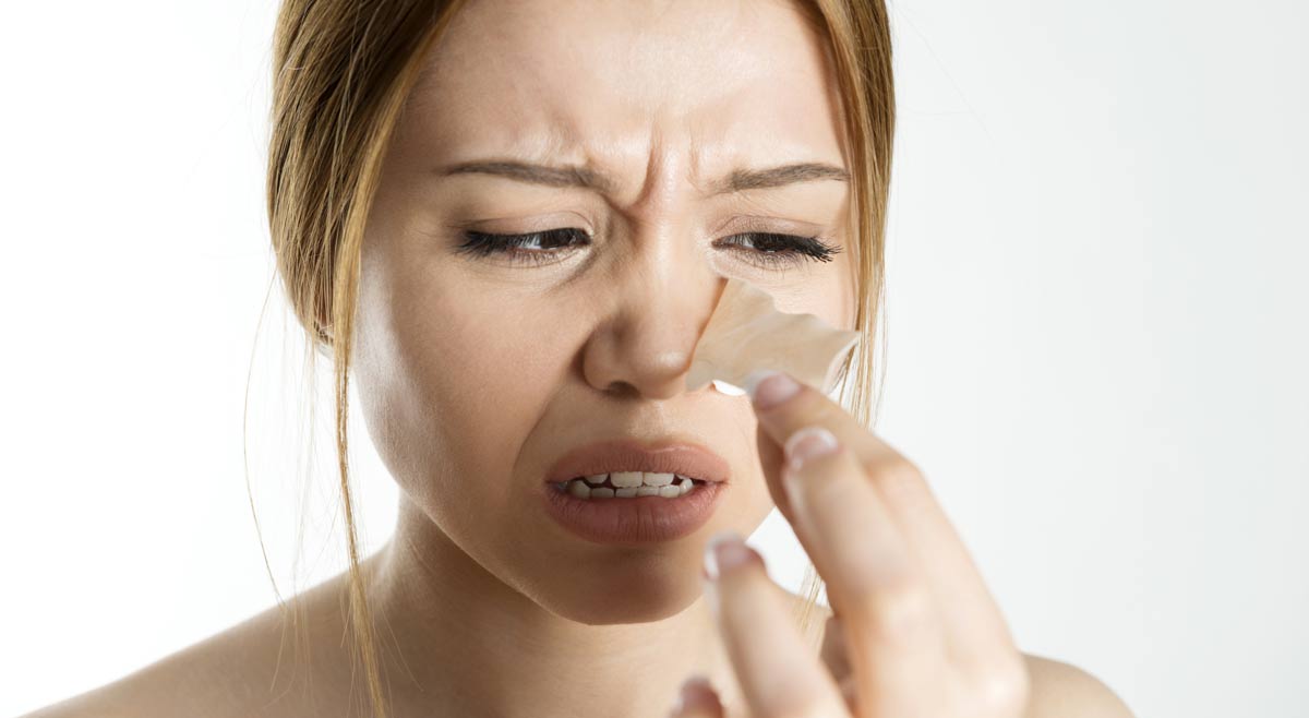 Woman frustrated with nasal strips